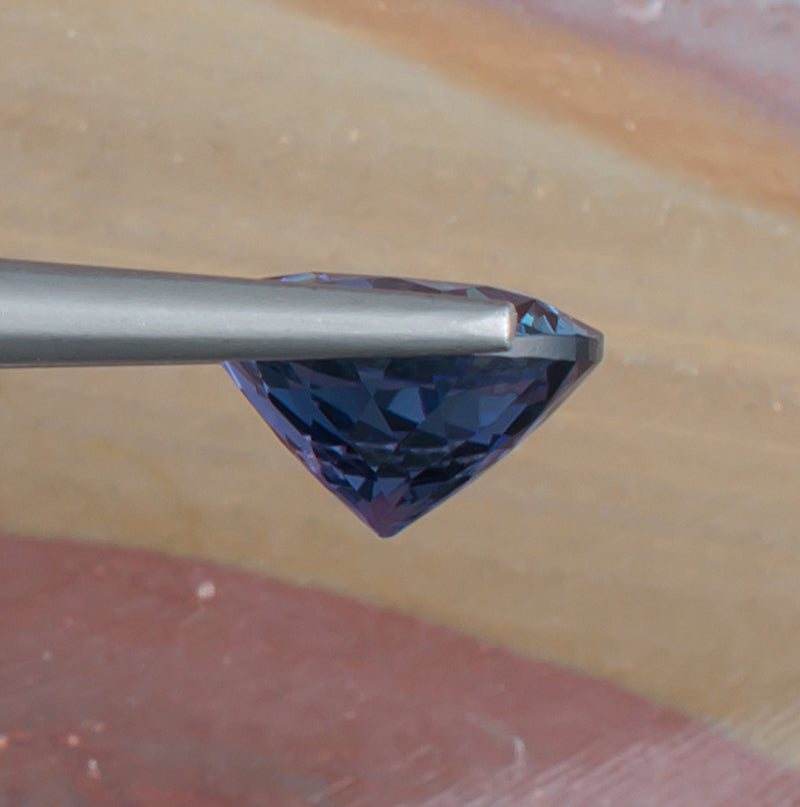 4.42ct Tanzanite Colored Gemstone Side View Natural Background 
