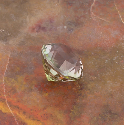 4.97ct Yellow Green Tourmaline Colored Gemstone Side View Stone Background
