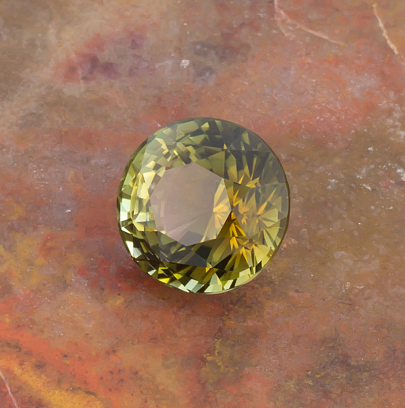 4.97ct Yellow Green Tourmaline Colored Gemstone Top View Stone Background
