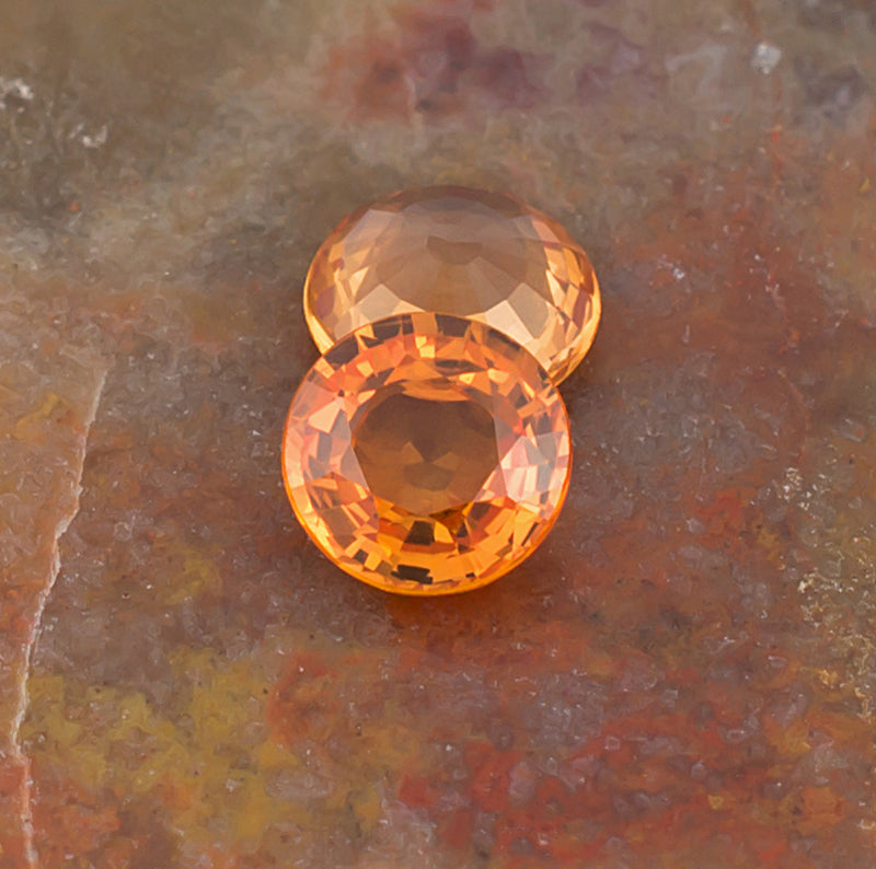5.00mm Orange Sapphire Colored Gemstone Pair Top View Natural Background
