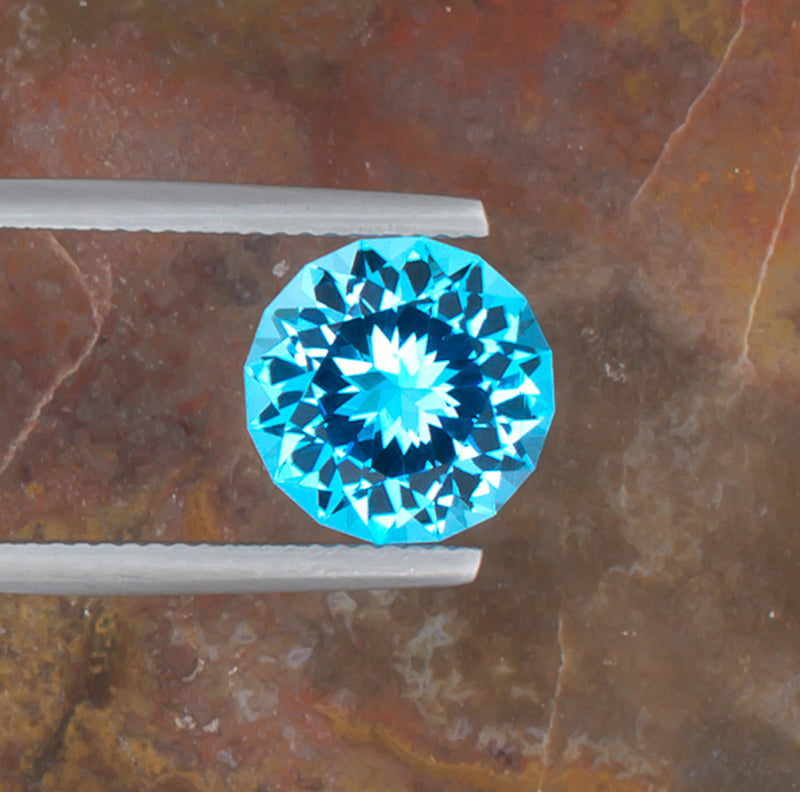 5.13ct Blue Topaz Colored Gemstone Top View Natural Background 
