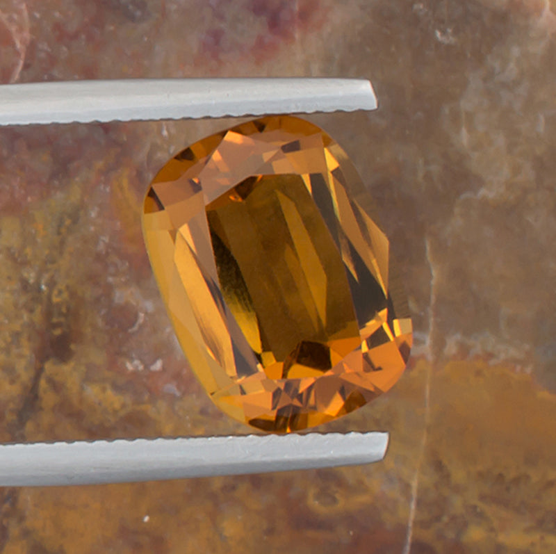 5.26ct Citrine Colored Gemstone Top View Angle Natural Background 

