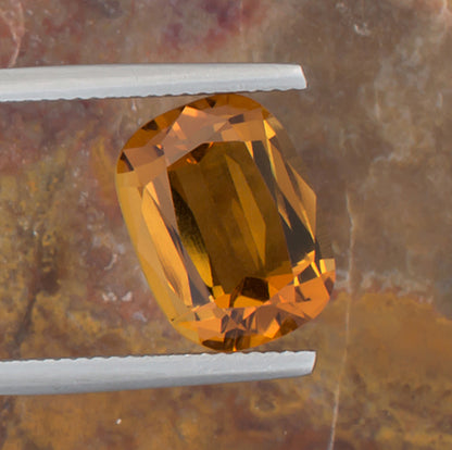 5.26ct Citrine Colored Gemstone Top View Angle Natural Background 

