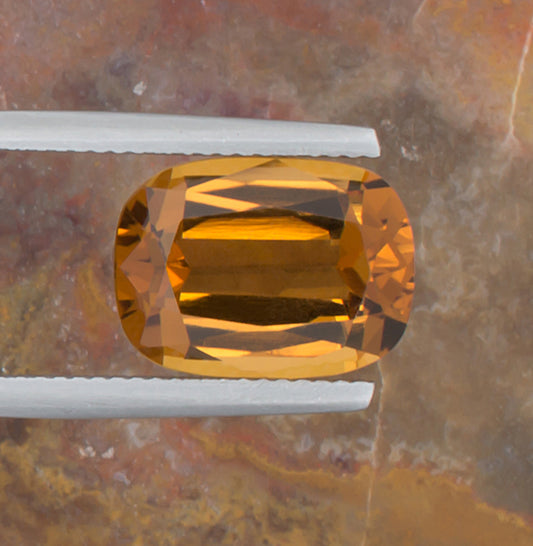5.26ct Citrine Colored Gemstone Top View Natural Background 
