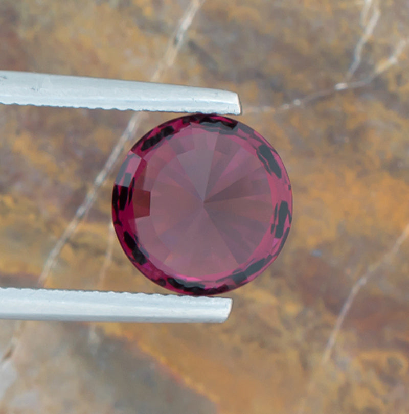 5.28ct Rhodolite Garnet Colored Gemstone Bottom View Natural Background 