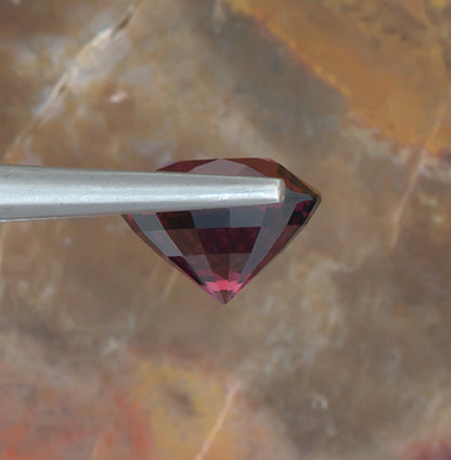 5.28ct Rhodolite Garnet Colored Gemstone Side View Natural Background 