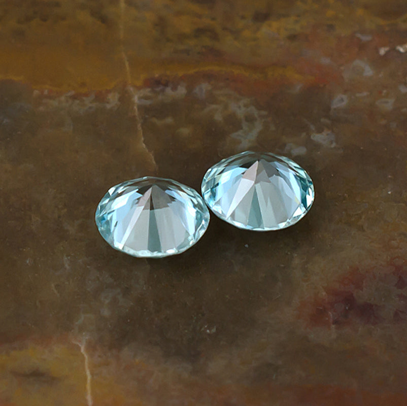 5.30mm Blue Zircon Colored Gemstone Pair Bottom View Natural Background
