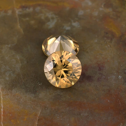5.50mm Golden Zircon Colored Gemstone Pair Top and Bottom View Natural Background
