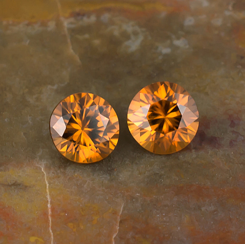 5.50mm Orange Zircon Colored Gemstone Pair Top View Natural Background

