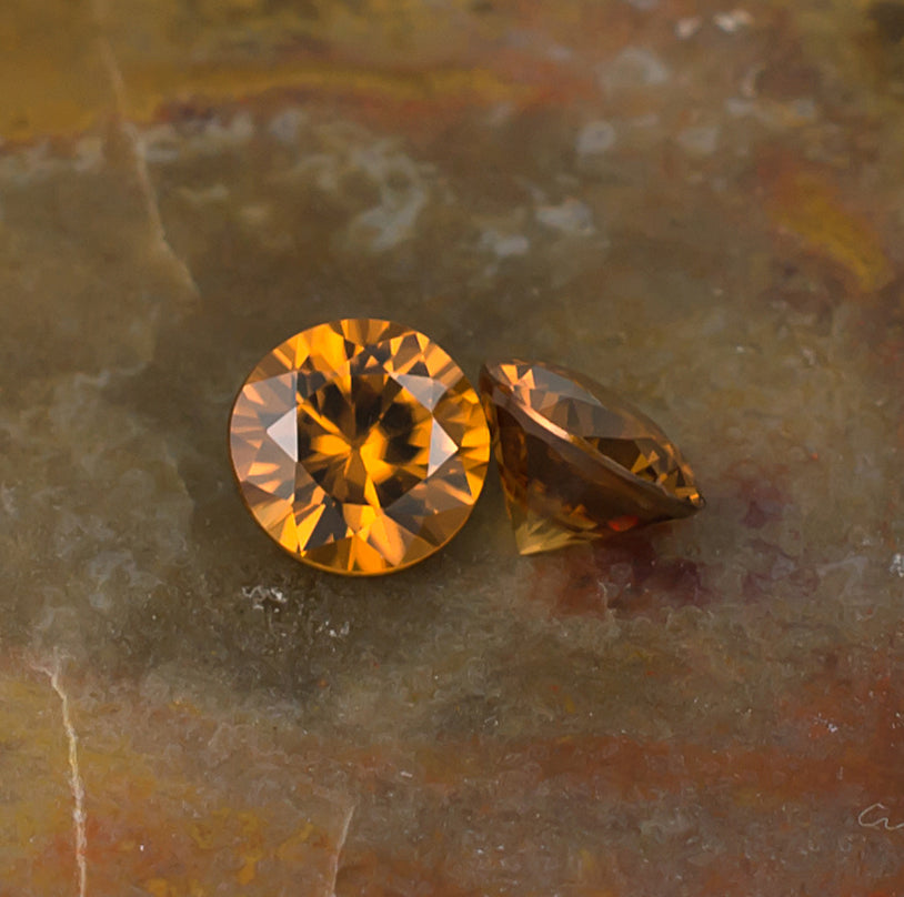 5.50mm Orange Zircon Colored Gemstone Pair Top & Bottom View Natural Background
