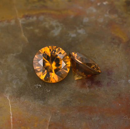 5.50mm Orange Zircon Colored Gemstone Pair Top & Bottom View Natural Background
