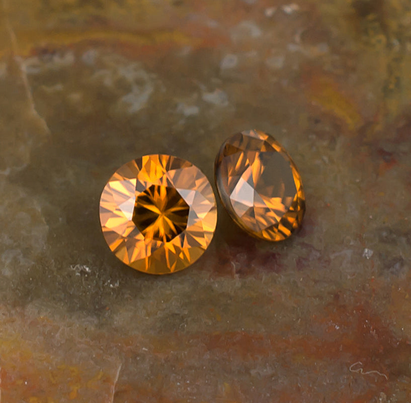 5.50mm Orange Zircon Colored Gemstone Pair Top & Bottom View Natural Background
