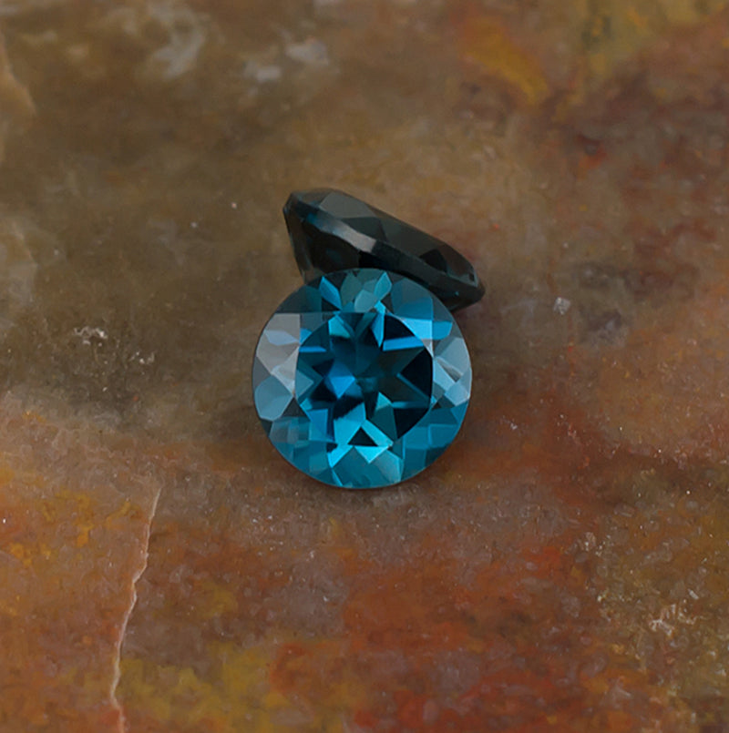 6.00mm Blue Topaz Colored Gemstone Pair Top & Bottom View Natural Background
