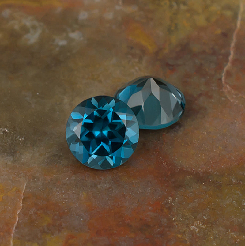 6.00mm Blue Topaz Colored Gemstone Pair Top & Bottom View Natural Background
