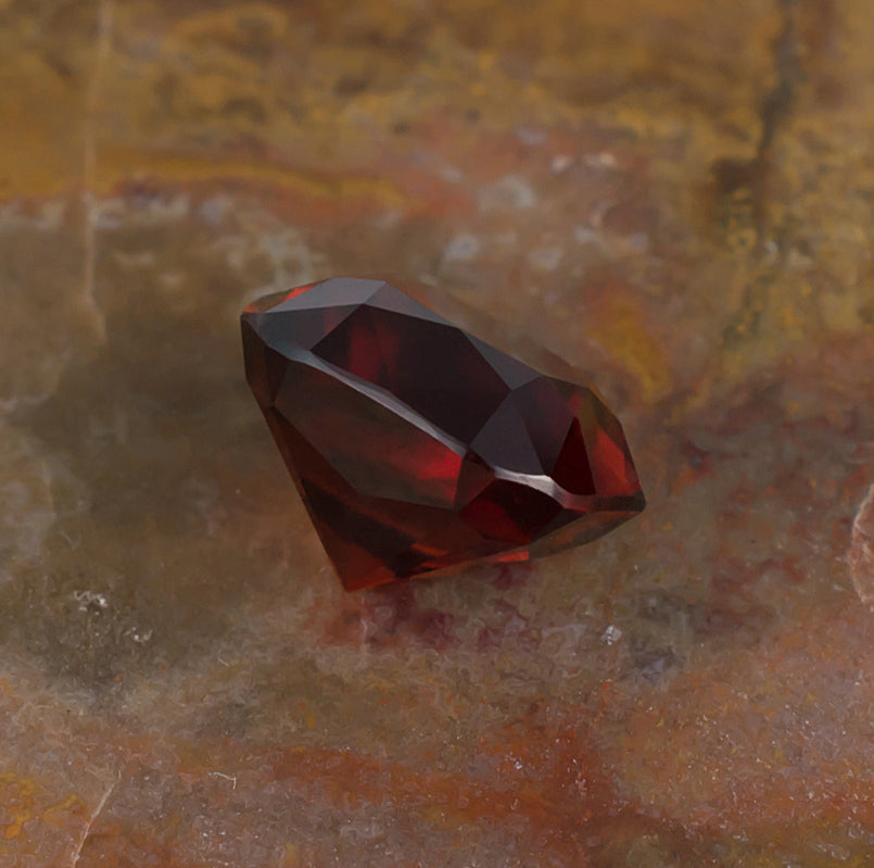 6.45ct Hessonite Garnet Colored Gemstone Side View Natural Background
