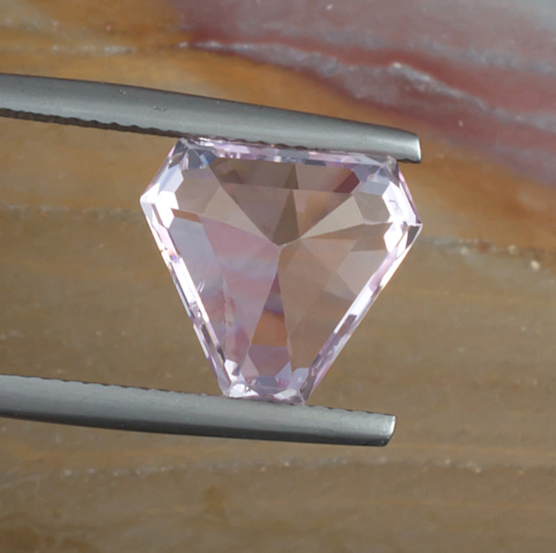 6.57ct Kunzite Colored Gemstone Bottom View Natural Background
