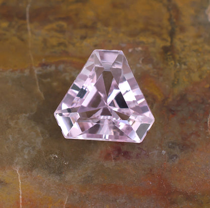 6.57ct Kunzite Colored Gemstone Crown View Natural Background
