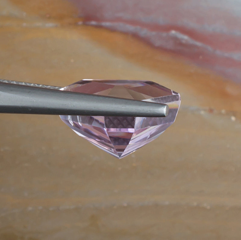 6.57ct Kunzite Colored Gemstone Side View Natural Background 

