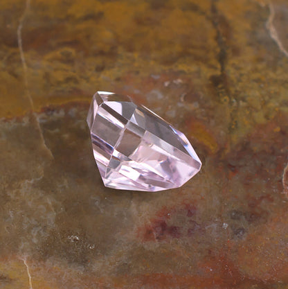 6.57ct Kunzite Colored Gemstone Side View Natural Background
