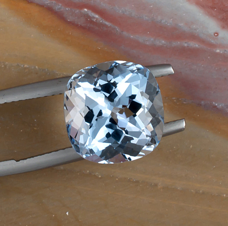 6.89ct Aquamarine Colored Gemstone Top View Natural Background 
