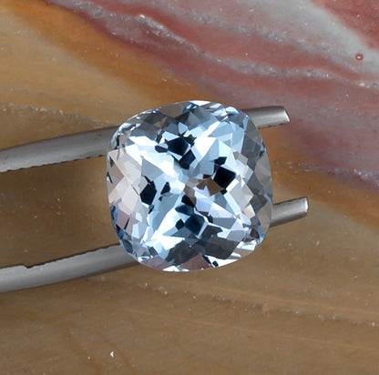 6.89ct Aquamarine Colored Gemstone Top View Natural Background 
