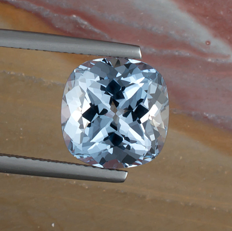 6.89ct Aquamarine Colored Gemstone Top View Natural Background 
