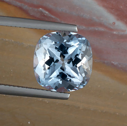 6.89ct Aquamarine Colored Gemstone Top View Natural Background 
