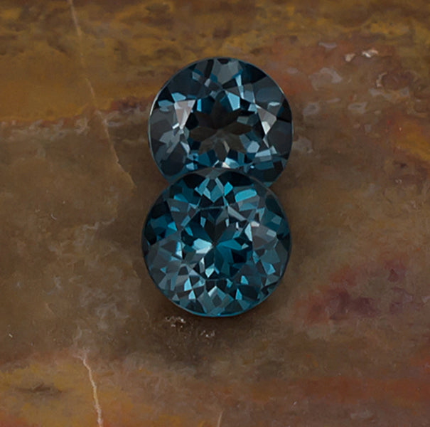 7.00mm Blue Topaz Colored Gemstone Pair Front & Side View Natural Background
