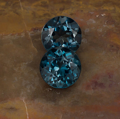 7.00mm Blue Topaz Colored Gemstone Pair Front & Side View Natural Background
