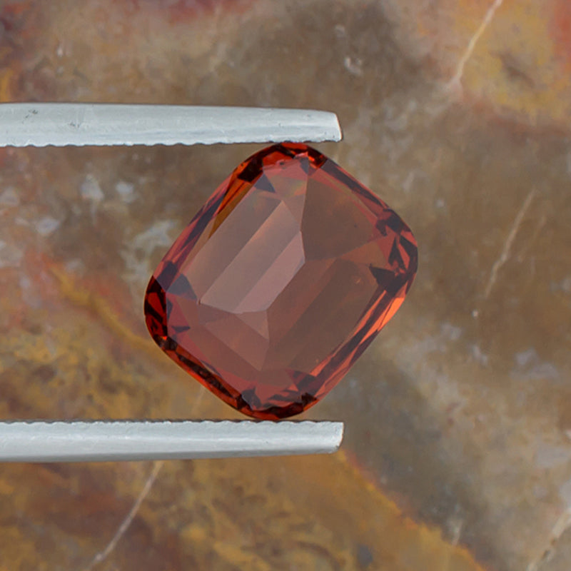 7.15ct Spessartite Garnet Colored Gemstone Bottom View Natural Background 