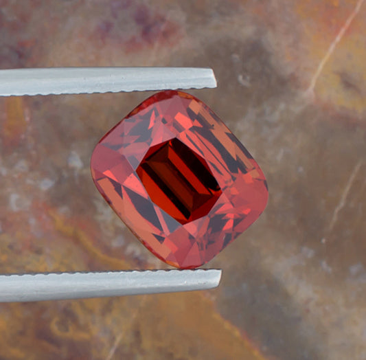 7.15ct Spessartite Garnet Colored Gemstone Top View Angle Natural Background 
