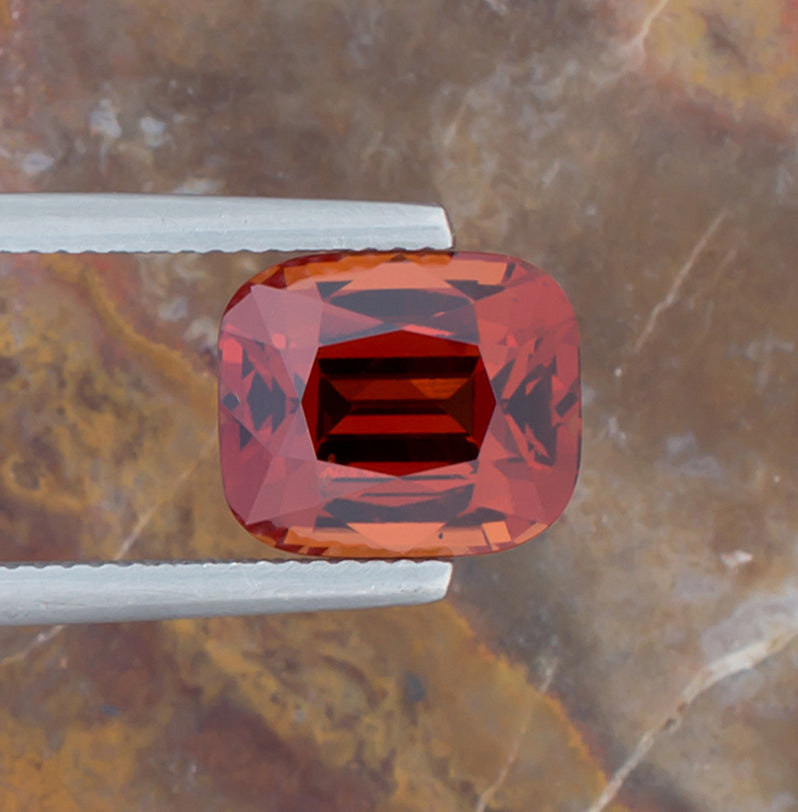 7.15ct Spessartite Garnet Colored Gemstone Top View Horizontal Natural Background 