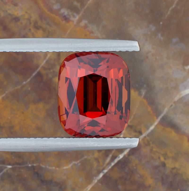 7.15ct Spessartite Garnet Colored Gemstone Top View Vertical Natural Background 