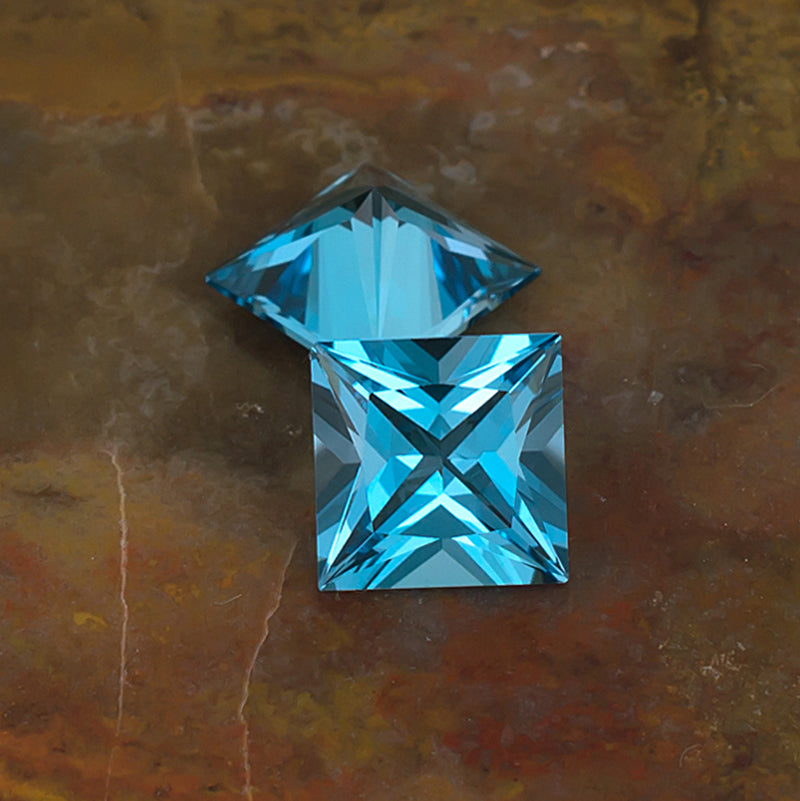 8mm Blue Topaz Colored Gemstone Pair Top Bottom View Natural Background
