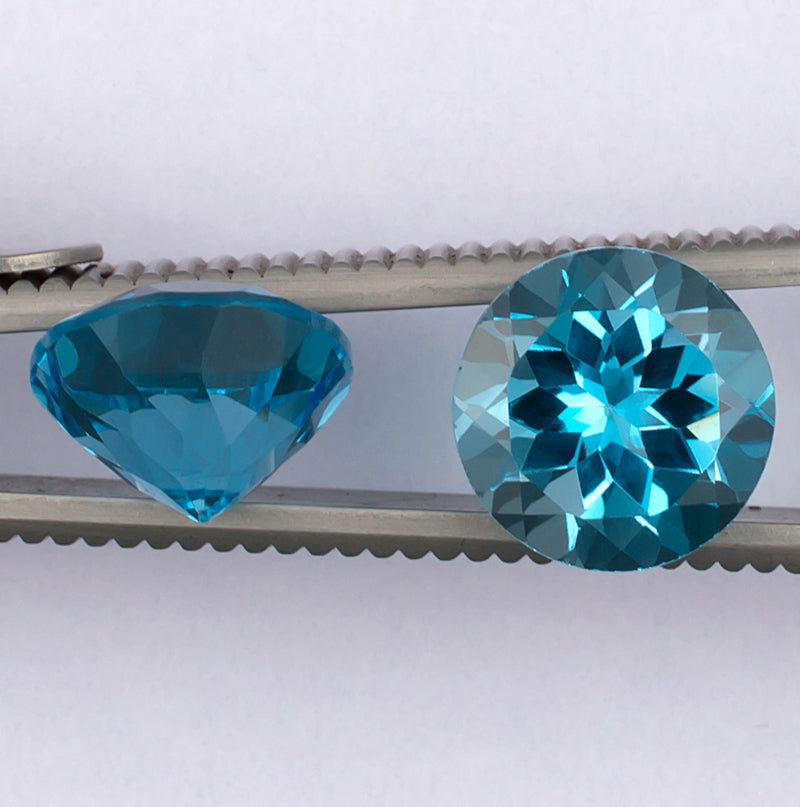 9.17twt Blue Topaz Colored Gemstone Pair Side View White Background
