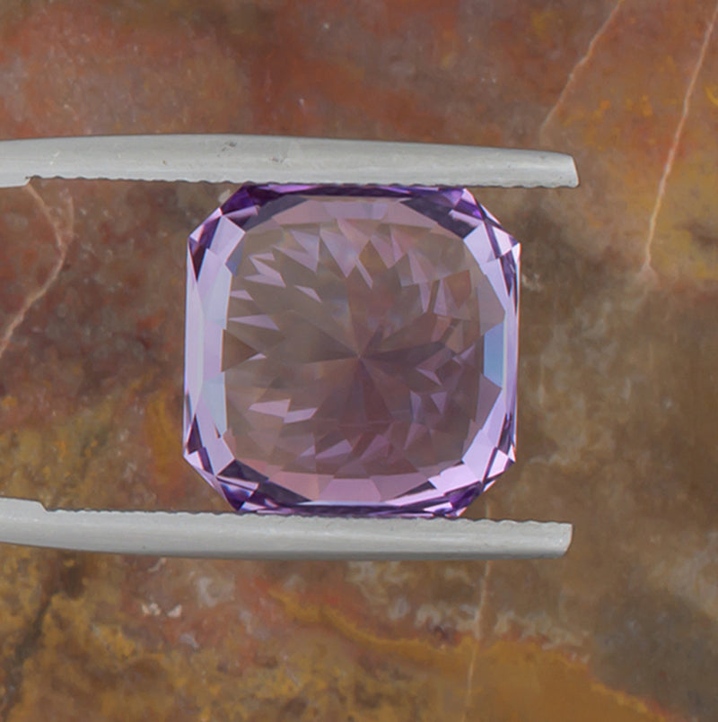 9.73ct Amethyst Colored Gemstone Bottom View Natural Background 
