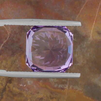 9.73ct Amethyst Colored Gemstone Bottom View Natural Background 
