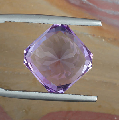 9.73ct Amethyst Colored Gemstone Bottom View Natural Background
