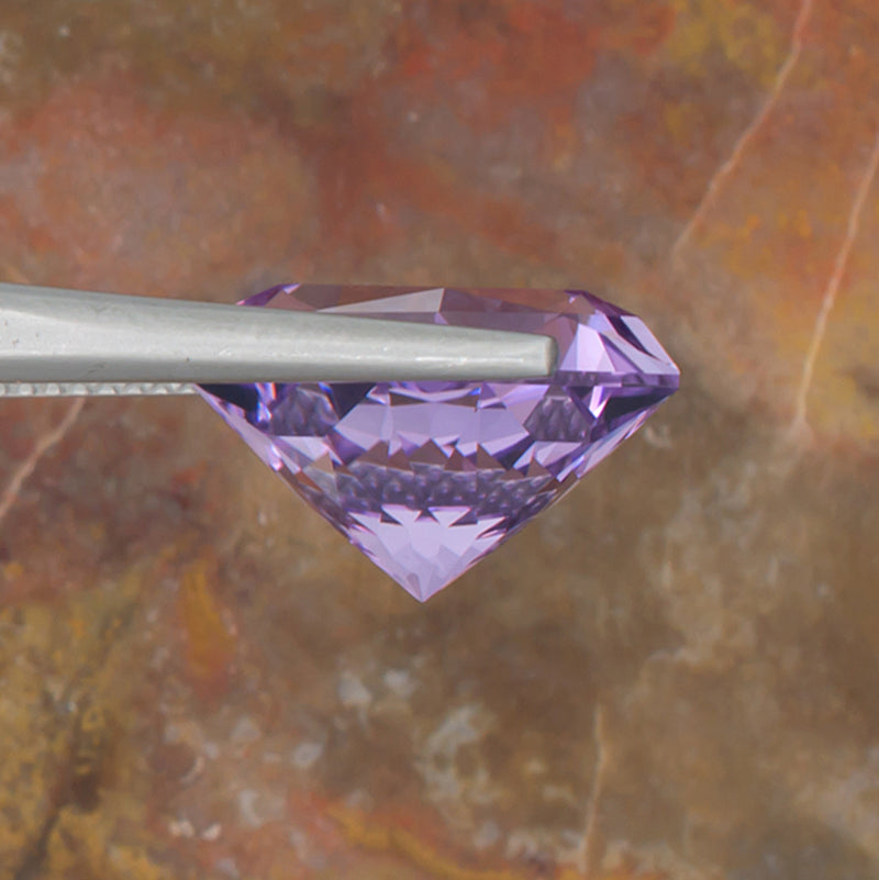 9.73ct Amethyst Colored Gemstone Side View Natural Background 
