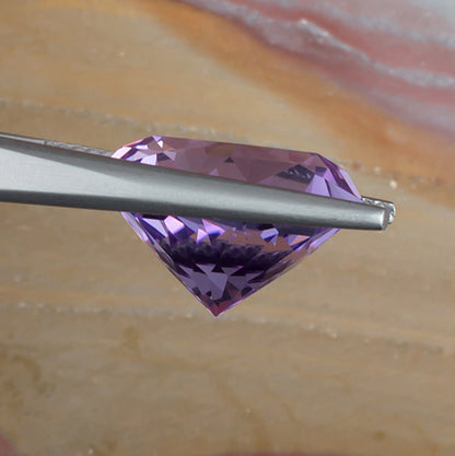 9.73ct Amethyst Colored Gemstone Side View Natural Background 
