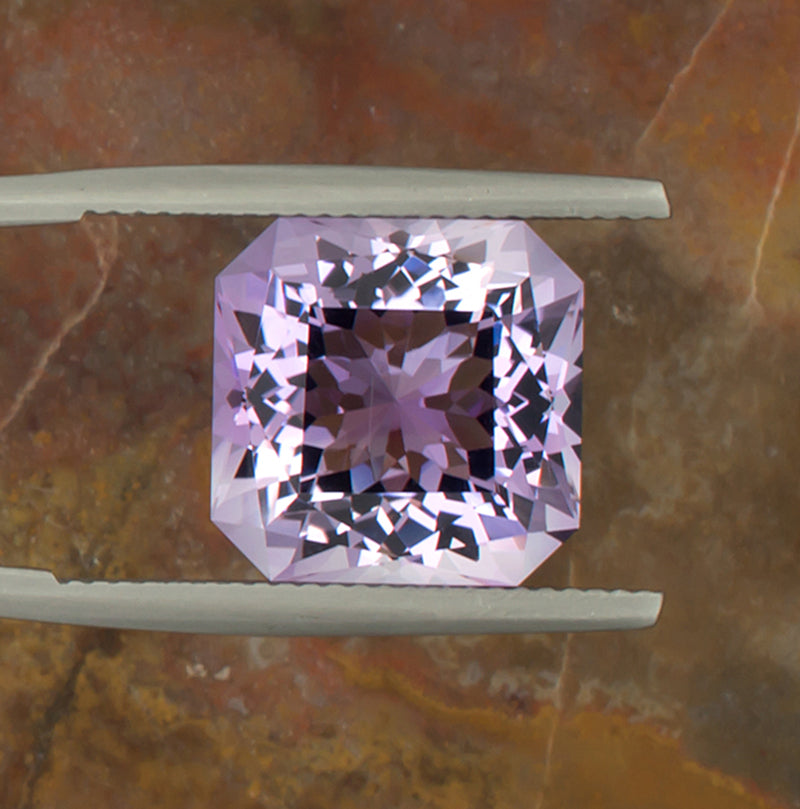 9.73ct Amethyst Colored Gemstone Top View Natural Background 
