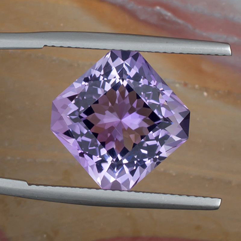 9.73ct Amethyst Colored Gemstone Top View Natural Background 
