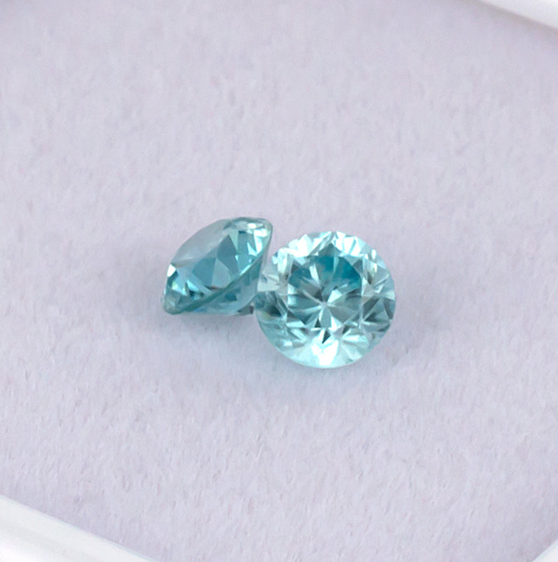 Blue Zircon Colored Gemstone Pair Top View White Background
