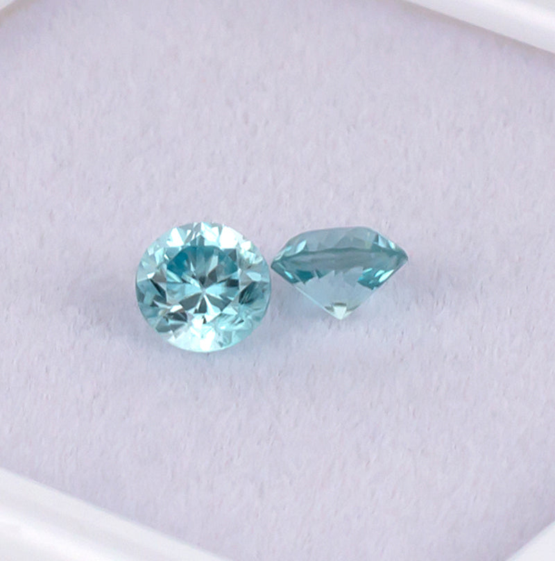 Blue Zircon Colored Gemstone Pair Top View White Background

