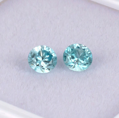 Blue Zircon Colored Gemstone Pair Top View White Background
