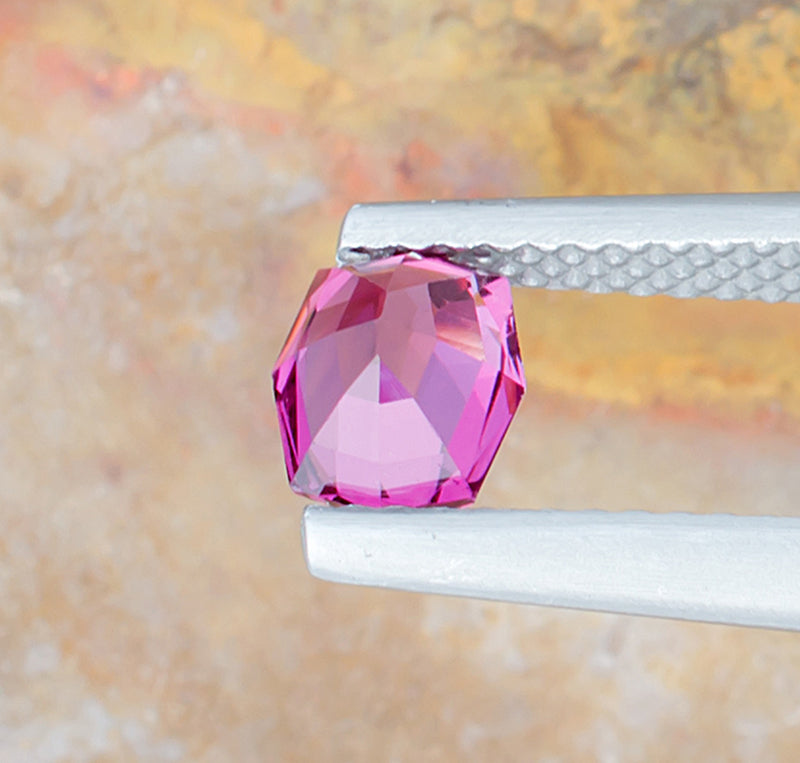 0.92ct Rhodolite Garnet Colored Gemstone Side View Natural Background