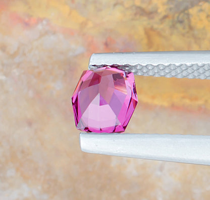 0.92ct Rhodolite Garnet Colored Gemstone Side View Natural Background