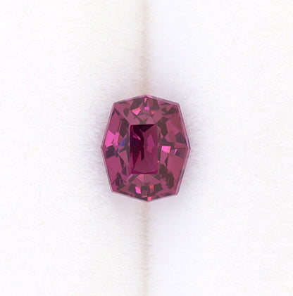 0.92ct Rhodolite Garnet Colored Gemstone Top View White Background Turned